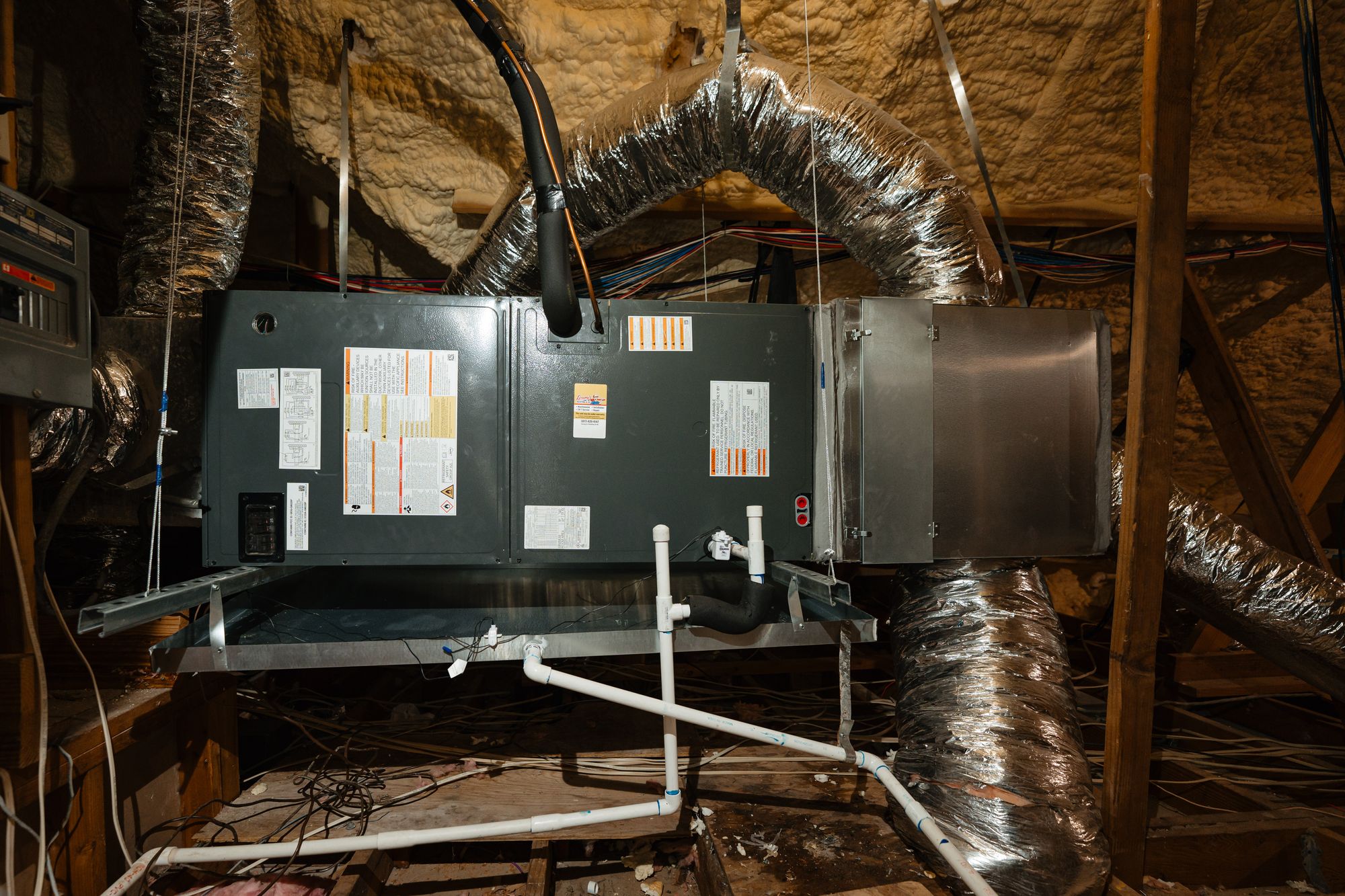 HVAC air handler and ductwork installed in a North Texas attic
